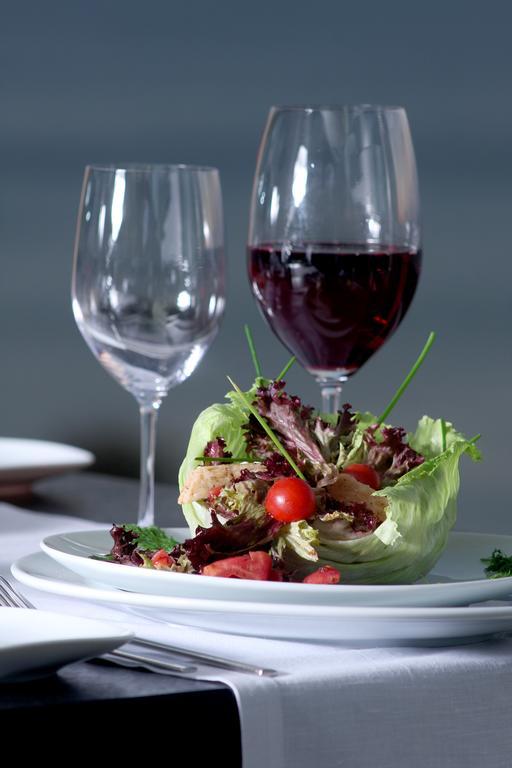 Eser Premium Hotel & Spa Buyukcekmece Exterior photo A salad and wine